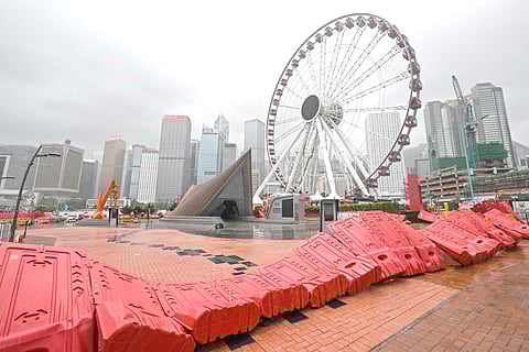 BARRICADES are blown down in the Central district as the typhoon signal number 10 is hoisted as typhoon 'Wipha' moves towards Hong Kong on 20 July 2025.