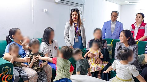 FIRST Lady Liza Araneta-Marcos shares an emotional moment with distressed OFWs during her historic visit to Bahay Kalinga in Riyadh.