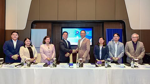 ADVENTPOWER President James Yu and SM Prime Holdings CFO John Nai Pei Ong seal a contract to supply renewable energy to four SM-affiliated schools under the Retail Aggregation Program. The ceremonial signing was witnessed by ERC Chairperson and CEO Atty. Monalisa Dimalanta, alongside officials from both AdventPower and SM Prime Holdings.