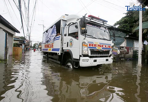 Rescue truck of Obando Bulacan carrying people as they conduct rescue and free ride as well to the stranded people, was seen passing through at the flooded road of Rincon road in Valenzuela City, on Tuesday 22 July 2025.