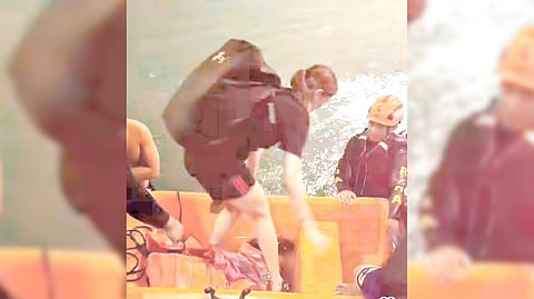 MIKA Reyes of the PLDT High Speed Hitters boards a rescue boat after getting stranded inside their training facility in Quezon City on Monday night.