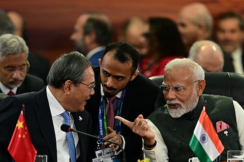 CHINA'S Premier Li Qiang (L) talks with India's Prime Minister Narendra Modi (R) during a plenary session of the BRICS summit in Rio de Janeiro, Brazil, on July 7, 2025. BRICS leaders at a summit on Sunday took aim at US President Donald Trump's "indiscriminate" import tariffs and recent Israeli-US strikes on Iran.