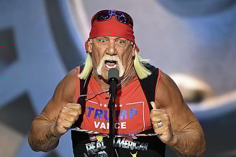 (FILES) US pro-wrestler Hulk Hogan rips his shirt off to reveal a Trump-Vance campaign shirt during the last day of the 2024 Republican National Convention at the Fiserv Forum in Milwaukee, Wisconsin, on July 18, 2024. Hulk Hogan, the iconic face of professional wrestling in the 1980s who parlayed his prowess in the ring into an acting career, has died at the age of 71, US media reported on July 24, 2025. Hogan -- known for his towering 6'7" (two-meter) physique, bandana and distinctive blond handlebar mustache -- died at his home in Florida, NBC News reported, citing his manager Chris Volo. TMZ also reported the news, citing unnamed sources.


