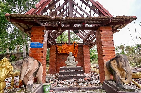 A pagoda damaged by Thai artillery is pictured in Oddar Meanchey province on July 25, 2025. Thailand's acting Prime Minister Phumtham Wechayachai warned on July 25 that cross-border clashes with Cambodia that have uprooted more than 130,000 people "could develop into war", as the countries traded deadly strikes for a second day.
