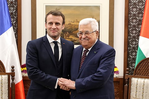 French President Emmanuel Macron (L) shakes hands with Palestinian President Mahmoud Abbas at his headquarters in the West Bank city of Ramallah, on January 22, 2020. French President said on July 24, 2025 his country would formally recognise a Palestinian state during a UN meeting in September, the most powerful European nation to announce such a move.
