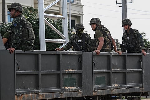 Royal Thai Army soldiers are transported on the back of an army truck in the Thai border province of Si Sa Ket on July 26, 2025. Thailand and Cambodia pounded each other with heavy artillery fire for a third day on July 26, as a border conflict that killed at least 33 people and displaced more than 150,000 from their homes spread across the frontier.
