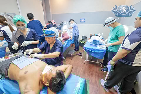 VOLUNTEERS and staff transformed one of the Tzu Chi Eye Center’s consultation rooms into a bustling minor surgical theater.