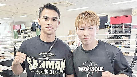Hot prospect Criztian Laurente (left) poses with undisputed world super-bantamweight champion Naoya Inoue during a break in training in Yokohama, Japan.