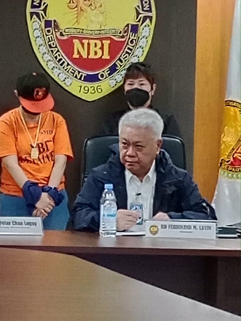 NBI spokesperson Ferdinand Lavin presents the Chinese woman who misrepresent as a Filipina.