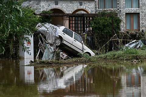 A DAMAGED car is seen in a flooded neighbourhood in Miyun district, on the outskirts of Beijing on July 29, 2025. Heavy rain in Beijing killed 30 people and forced authorities to evacuate tens of thousands as swathes of northern China were lashed by torrential downpours that sparked deadly landslides, state media said on July 29.