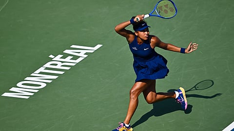 Naomi Osaka of Japan plays a forehand against Ariana Arseneault of Canada during their first round match on Day Two of the WTA 1000 National Bank Open at IGA Stadium on July 28, 2025 in Montreal, Quebec, Canada.
