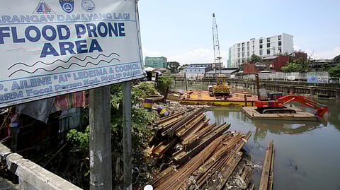  Steel sheet piles are seen at an ongoing Department of Public Works and Highways (DPWH) flood control project along the flood-prone San Juan River in Barangay Damayang Lagi, Quezon City. The construction activity comes a day after President Ferdinand Marcos Jr., in his fourth State of the Nation Address, ordered a review of all government flood control projects and a crackdown on corrupt officials linked to anomalies. 