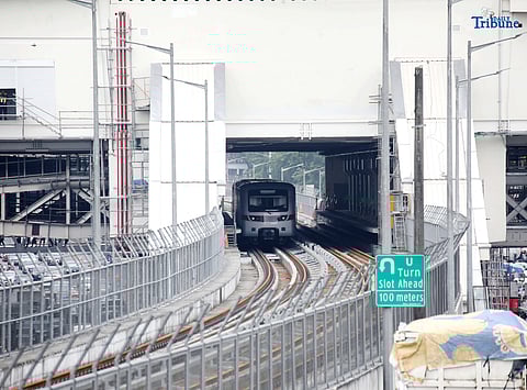  A Metro Rail Transit Line 7 (MRT-7) train is seen parked at Don Antonio Station along Commonwealth Avenue in Quezon City on Monday, July 28, 2025. The 22-kilometer elevated railway connecting Metro Manila to Bulacan via Commonwealth Avenue is expected to begin trial runs by the end of 2025, according to operator San Miguel Corporation.