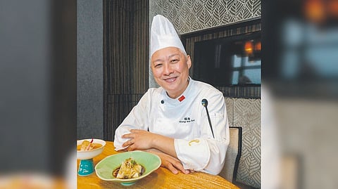 Walking culinary library: Chef Raymond Yeung shows off his signature dishes while talking food history.