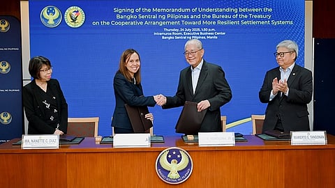 BSP Governor Eli M. Remolona, Jr. (3rd from left) and National Treasurer Sharon P. Almanza (2nd from left) seal the renewed BSP-BTr partnership with a handshake during the signing of a memorandum of understanding on 24 July 2025. Joining them are BSP Deputy Governor Mamerto E. Tangonan (rightmost) and BTr Officer-in-Charge Deputy Treasurer Ma. Nanette C. Diaz (leftmost).