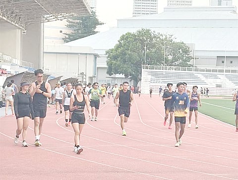 RUNNERS enjoy free access to the track oval of the Rizal Memorial Sports Complex on Thursday. 