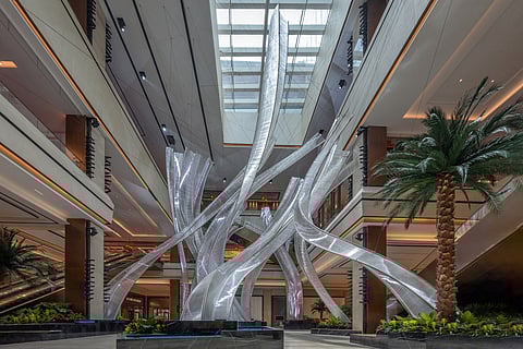 Soaring masterpiece. Within the luxury property Solaire Resort North is the ‘Largest Glass Tube Installation, The Mangrove,’ as recognized by the Guinness World Records. Measuring 25.396 meters high, the sculptural work is designed by renowned sculptor Nikolas Weinstein — ‘a breathtaking symbol of the intersection of nature, art and innovation.’ (Inset) Emi Saito, official adjudicator of the Guinness World Records, with Gregory Hawkins, president and chief operating officer of Solaire Resorts, at the event.