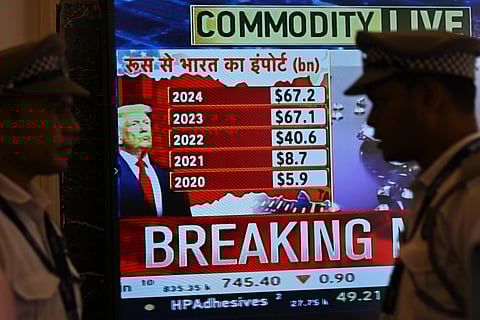 A broadcast screen of the Bombay Stock Exchange (BSE) is pictured in Mumbai on July 31, 2025, which shows India's exports with Russia while depicting news of US President Donald Trump unveiling sweeping new trade tariffs.