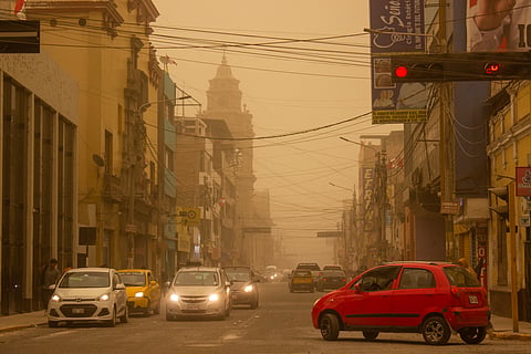 General view of a street as dust covers the sky during sand storm in Ica, Peru on July 31, 2025. Paracas' winds created an unusual sand storm that covered with a dense cloud of dust the sky of several cities in Peru forcing the closure of several roads in the area.
