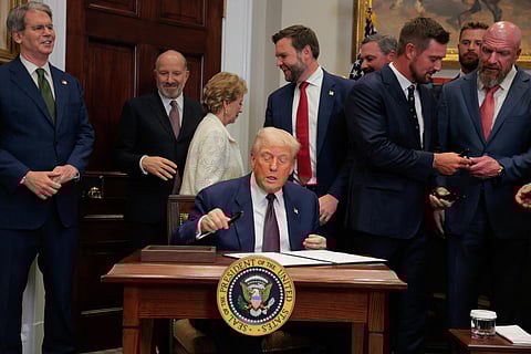 WASHINGTON, DC - JULY 31: U.S. President Donald Trump signs an executive order in the Roosevelt Room of the White House on July 31, 2025 in Washington, DC. Trump signed a series of orders that will expand on his council on sports, fitness and nutrition, including by reviving the Presidential Fitness Test in public schools. 