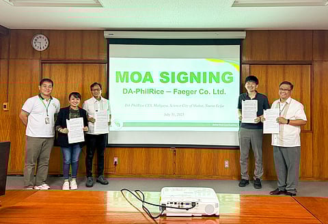 PhilRice Deputy Executive Director for Research Dr. Eduardo Jimmy Quilang, Executive Director Dr. John de Leon, Faeger Co., Ltd. Director Kazuki Sakamoto, and Faeger Co., Ltd. Project Coordinator Rachelle S. Martin show the signed MOA for the construction of a research laboratory on climate-smart farming.
