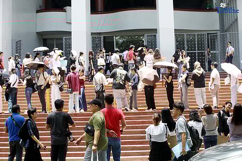 University of the Philippines college admission test examinees queue to enter Palma Hall to take admission test at Diliman campus on Saturday 2 August. UPCAT is part of the admission requirements of the UP System and is administered to Filipino and foreign high school graduates. Photo/Analy Labor
