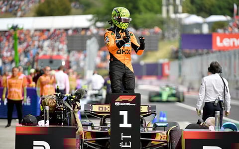McLaren's British driver Lando Norris is celebrates after winning the Formula One Hungarian Grand Prix at the Hungaroring circuit in Mogyorod near Budapest, Hungary, on August 3, 2025.
