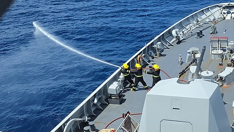 BRP Jose Rizal personnel train on using fire hoses during their joint maritime drills with the Indian Navy. 