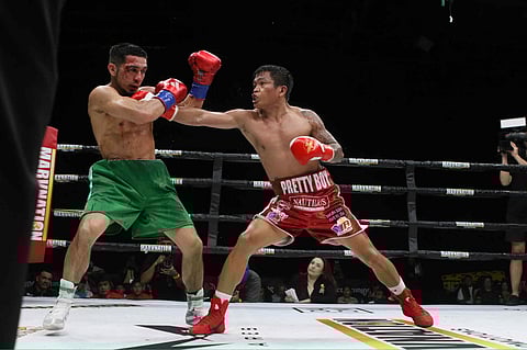 Jerwin Ancajas (right) stays on the right track for a world title shot after beating Uruguayan Ruben Casero in their right-round super-bantamweight bout in Long Beach, California.