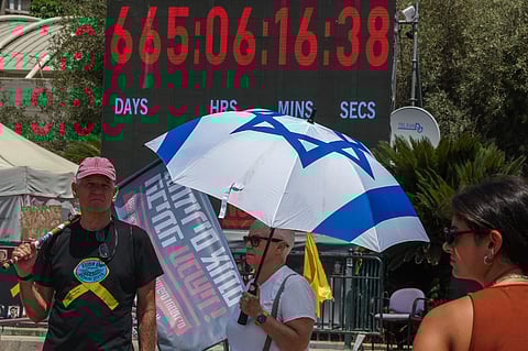 Families of Israelis held hostage in the Gaza Strip since October 2023 demonstrate in Tel Aviv's 'Hostage' square during US envoy Steve Witkoff's visit on August 2, 2025. Witkoff met the families of hostages on August 2, according to the main association representing them, with a cellphone video posted online showing the Washington negotiator arriving at the square in Tel Aviv square that has become known for protests by supporters of the hostages' families, and being greeted with applause and pleas for help.
