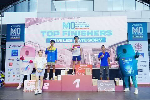JAMES Orduña (center) celebrates after beating Ritche Estampador (left) and James Kevin Cruz in the men’s 16K event of the Rexona Metro Manila 10 Miler Series 2025 Parañaque leg on Sunday at Parqal Aseana City.    