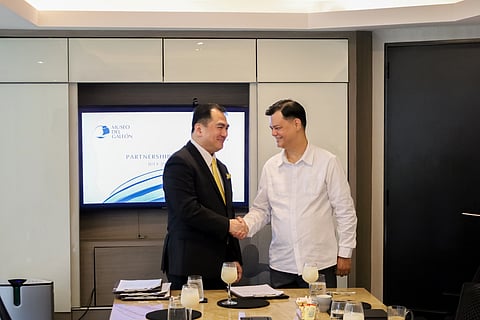 Atty. Nilo T. Divina (left), Founder and Managing Partner of DivinaLaw, with Museo del Galeón Executive Director Manuel L. Quezon III (right) during the ceremonial signing of the Memorandum of Agreement at the DivinaLaw office in Makati City. 