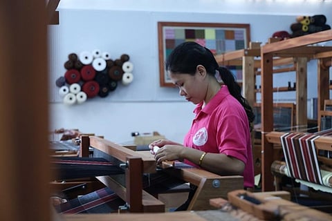 WEAVERS from the Progressive Ladies League of the Philippines show their skills in weaving textiles during the launching ceremony of the new Philippine Handloom Weaving Center at DOST-PTRI. 