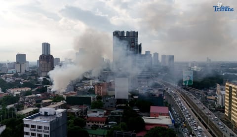 (August 06 2025) Smoke billows from a 2nd alarm fire involving a residential area along Scout Rallos in Barangay South Triangle, Quezon City on Wednesday, August 6, 2025. Photo/Analy Labor