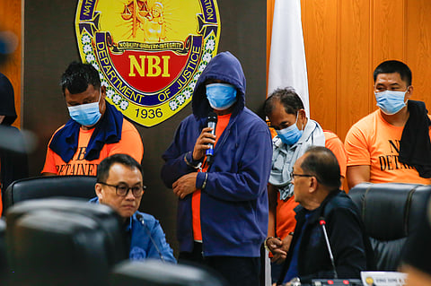 Officials of the National Bureau of Investigation present San Simon, Pampanga Mayor Abundo Punsalan Jr. and his security detail at the NBI Headquarters following their arrest in an entrapment operation for allegedly extorting money.