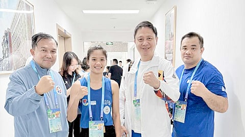 Rudzma Abubakar (second from left) beams with pride after beating Ukrainian Anastasiia Mychailenko, 30-27, in their women’s muay thai -48kg quarterfinal match in the World Games in Chengdu, China, on Friday. Joining him (from left) are Team Philippines Chef de Mission Stephen Arapoc, PSC Chairman Patrick Gregorio and Muay head coach Billy Alumno.