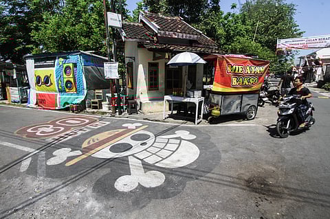 A GRAFITTI of the pirate flag from Japanese anime ‘One Piece,’ adopted by some Indonesians as a symbol of frustration with their government, is seen on a street in Sukoharjo, Central Java, on 6 August 2025, ahead of the country’s 80th Independence Day. 