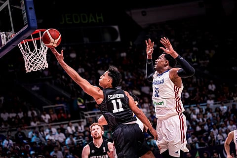 Flynn Cameron of New Zealand slips past the defense of Gilas Pilipinas’ Justin Brownlee during the Tall Black’s 94-86 win in Group D of the 2025 FIBA Asia Cup.