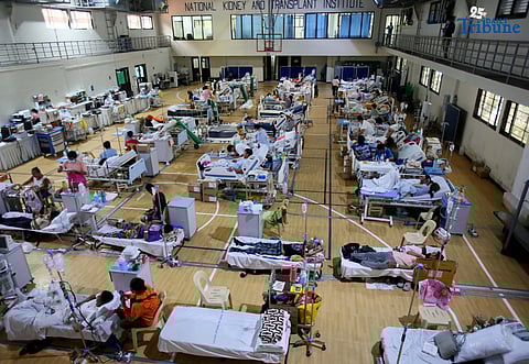 Doctors and nurses attend to a leptospirosis patient at the National Kidney and Transplant Institute (NKTI) in Quezon City on Friday, August 8, 2025. The NKTI reported a rise in leptospirosis admissions amid heavy rains and flooding across Metro Manila. The Department of Health has urged the public to avoid wading through floodwaters and to seek early medical consultation if symptoms appear.