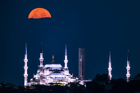 THE sturgeon supermoon rises over the Sultan Ahmed Mosque (Sultan Ahmet Mosque), also known as Blue Mosque, in Istanbul on August 9, 2025.