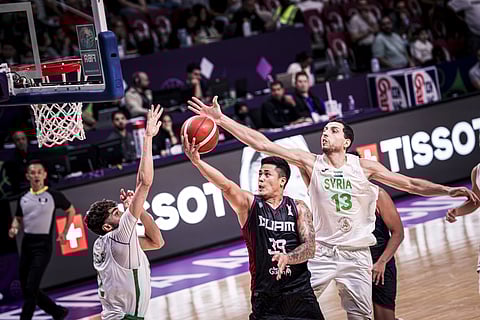 JERICHO Cruz drives to the basket, while #13 Mohamad Bilal Atli, and #2 Omar Idelbi attempts to block the shot.