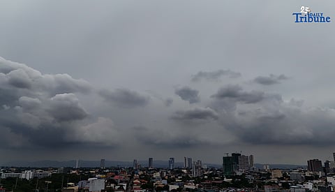 Dark clouds blanket Metro Manila’s skyline, as seen from Quezon City on Saturday, ahead of the possible entry of Severe Tropical Storm Pudol into the Philippine Area of Responsibility by Sunday evening or Monday afternoon, according to PAGASA.
