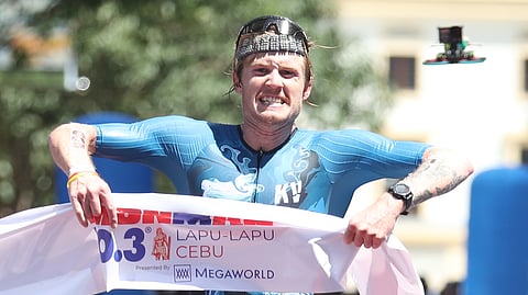 Josh Ferris of Australia gets a rousing welcome at the finish line in his conquest of the IRONMAN 70.3 Lapu-Lapu on Sunday in Cebu.