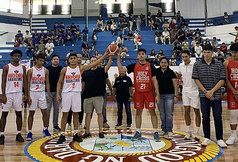 GLENN Escandor (middle) presides over the ceremonial jump ball during the opening of the 2025 Escandor Cup on Saturday at the Davao City Recreation Center.  