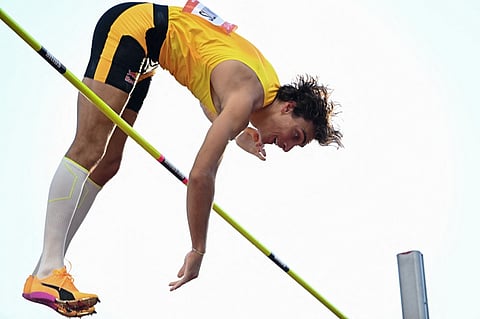 Sweden's Armand Duplantis clears the bar as he competes in the men's pole vault event of the Hungarian Athletics Grand Prix in Budapest, Hungary on August 12, 2025.
