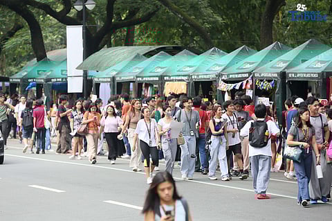 On the second day of school, students visit different organizations during the University of the Philippines Freshie Month Org Fair in front of Palma Hall at the UP Diliman campus in Quezon City on Tuesday, August 12, 2025. 