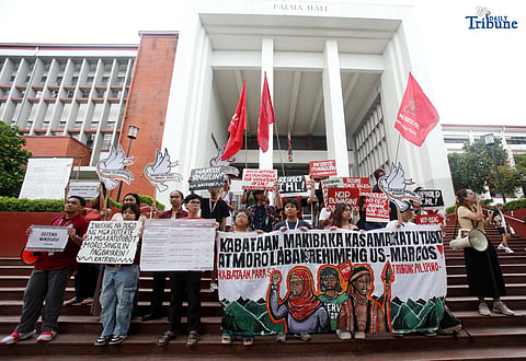  Members of the IP group Katribu stage a protest in front of Palma Hall at UP Diliman, Quezon City, on Tuesday, August 12, 2025, to mark the International Day of the World’s Indigenous Peoples.