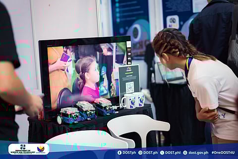 Gaze into the future A participant studies the gleaming intelligence of AI devices at a booth on the opening day of the 2025 AI Fest in Iloilo City, hosted by the Department of Science and Technology and its partner institutions.