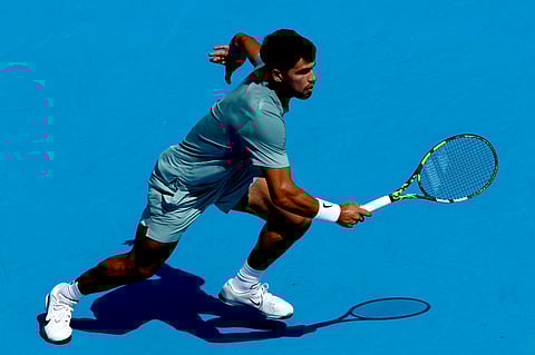 MASON, OHIO - AUGUST 12: Carlos Alcaraz of Spain chases down a ball while playing Hamad Medjedovic of Serbia during the Cincinnati Open at Lindner Family Tennis Center on August 12, 2025 in Mason, Ohio. 
