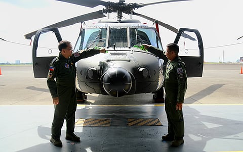 LtGen Cordura and MGen Ramil G Oloroso PAF, Commander, Air Mobility Command, lead the ceremonial pouring of champagne at the five newly acquired S-70i Black Hawk helicopters on August 13, 2025 at Clark Air Base, Mabalacat City, Pampanga. (Photo from PAF)